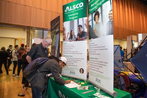 A student learns about Alsco at a previous job fair